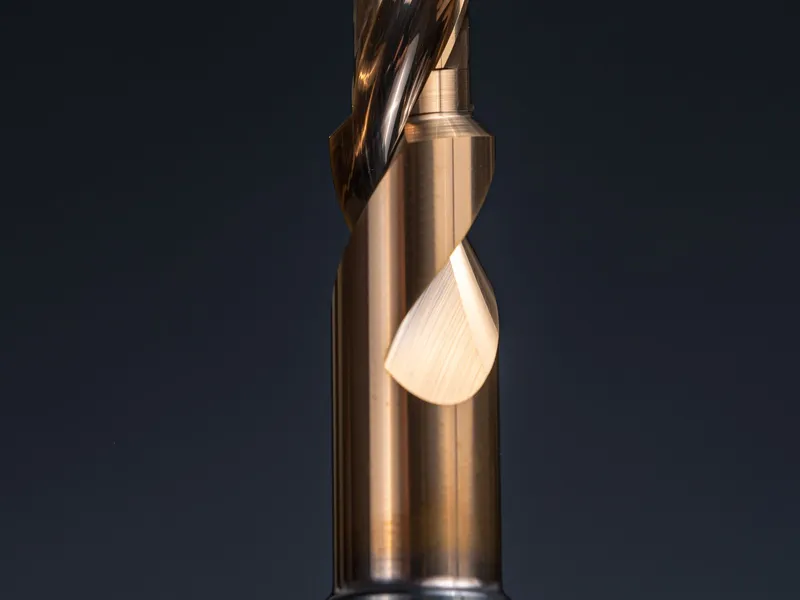 Carbide end mill cutting tool photographed against a dark background
