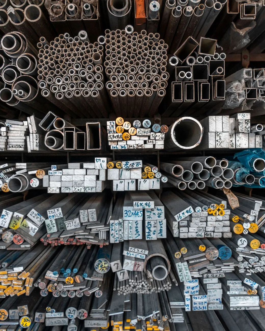 Steel bars, angles, and tubing racked in a metals service center